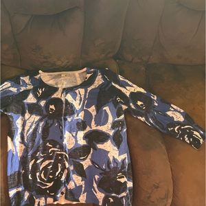 Sweater with floral type pattern.